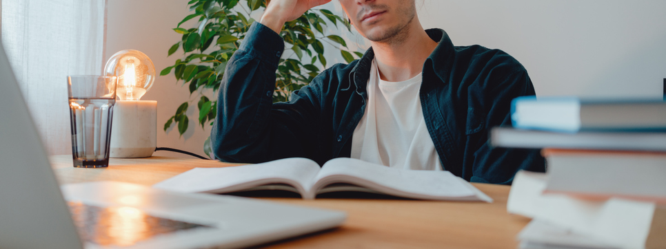 Online student prepare for pass exam to university using laptop. Adult man at college making universitet subjects